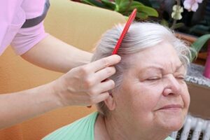 woman-getting-hair-combed